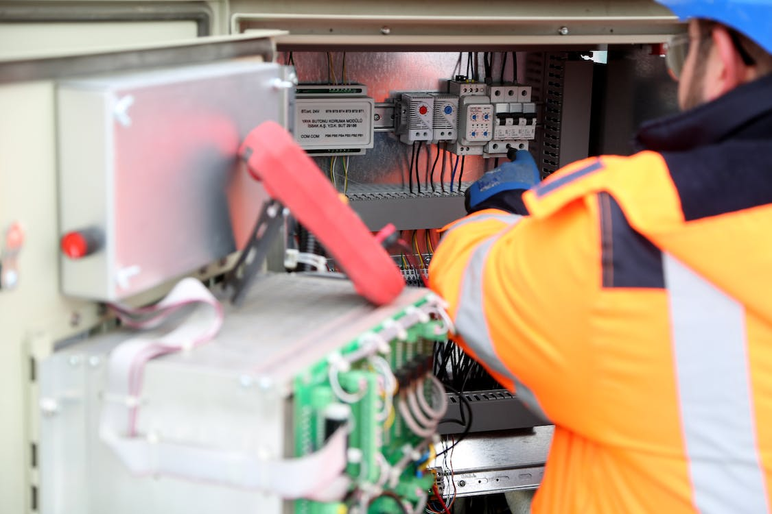 Electrician is fixing an inverter.